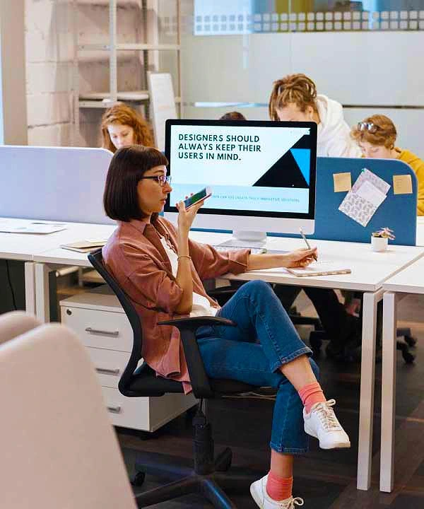 female office staff with office desk